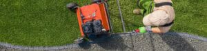 Birdseye view of a landscaper aerating a lawn