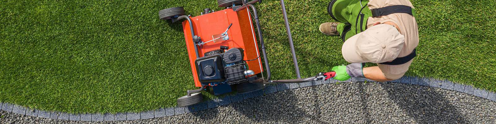 Birdseye view of a landscaper aerating a lawn